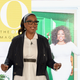 Image via Getty: Oprah stands behind Oprah